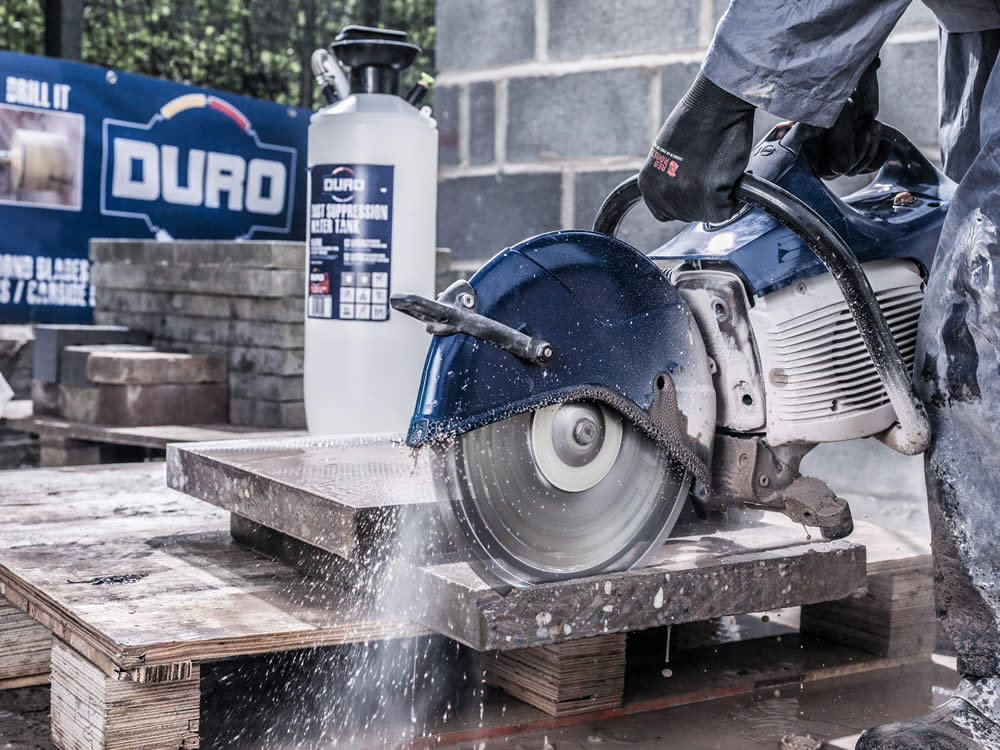 Wet and dry diamond blade cutting concrete on site